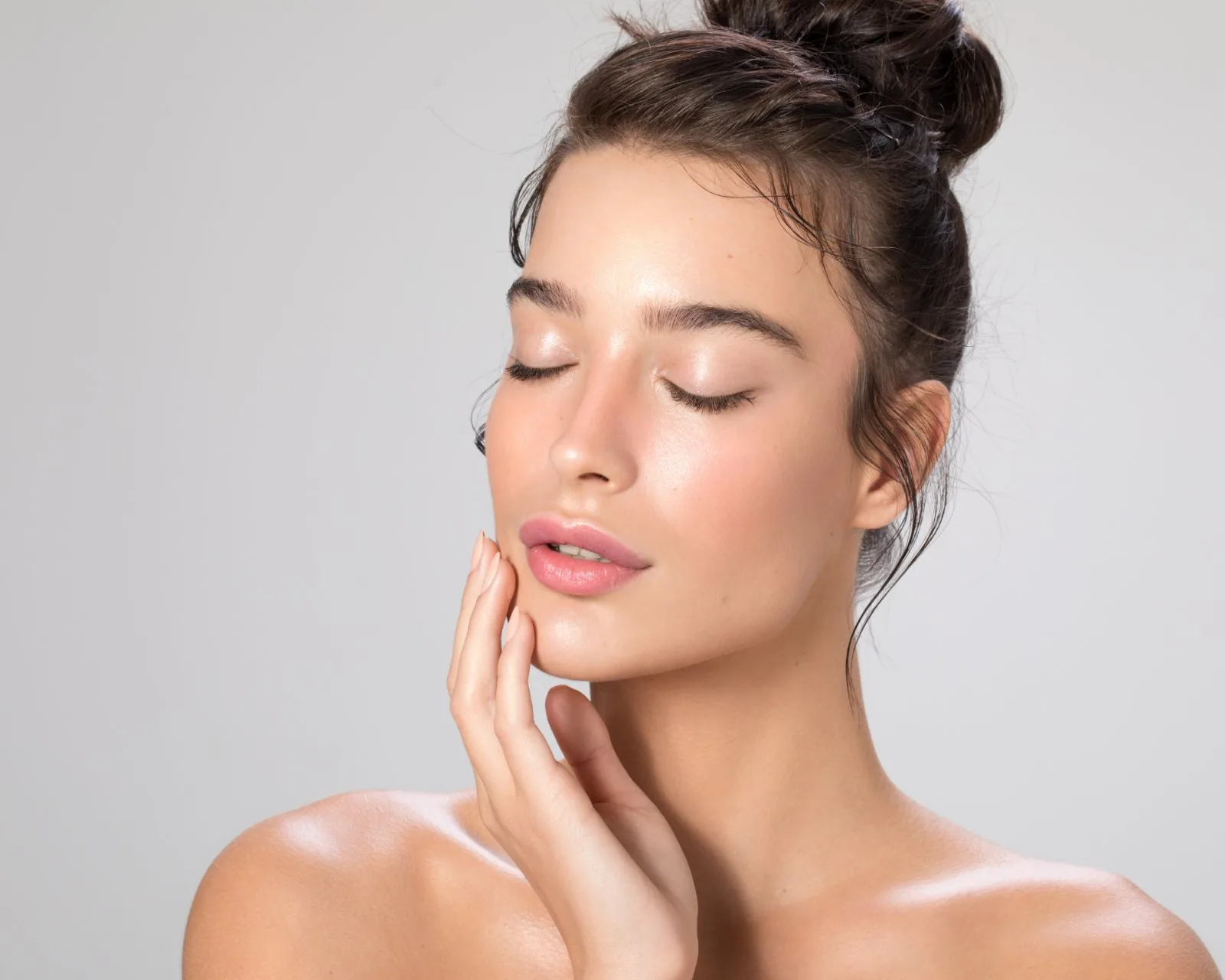 Elegant close-up of a woman with radiant, naturally refreshed skin at Forever Glow Aesthetics in Leander, TX